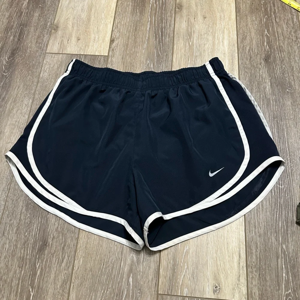 🛍️ Nike dri-fit black with white trimmed shorts great condition.